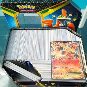 500 Authentic Pokemon tcgs + 1 used charizard card. Includes energy + trainers.